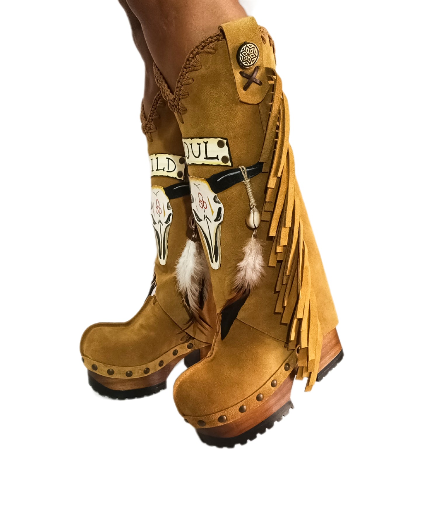 Camel suede cowboy boots. Clogs with hand-painted buffalo head, feathers, and fringes. Bohemian-style boots. High-end footwear handmade by Sol Caleyo.