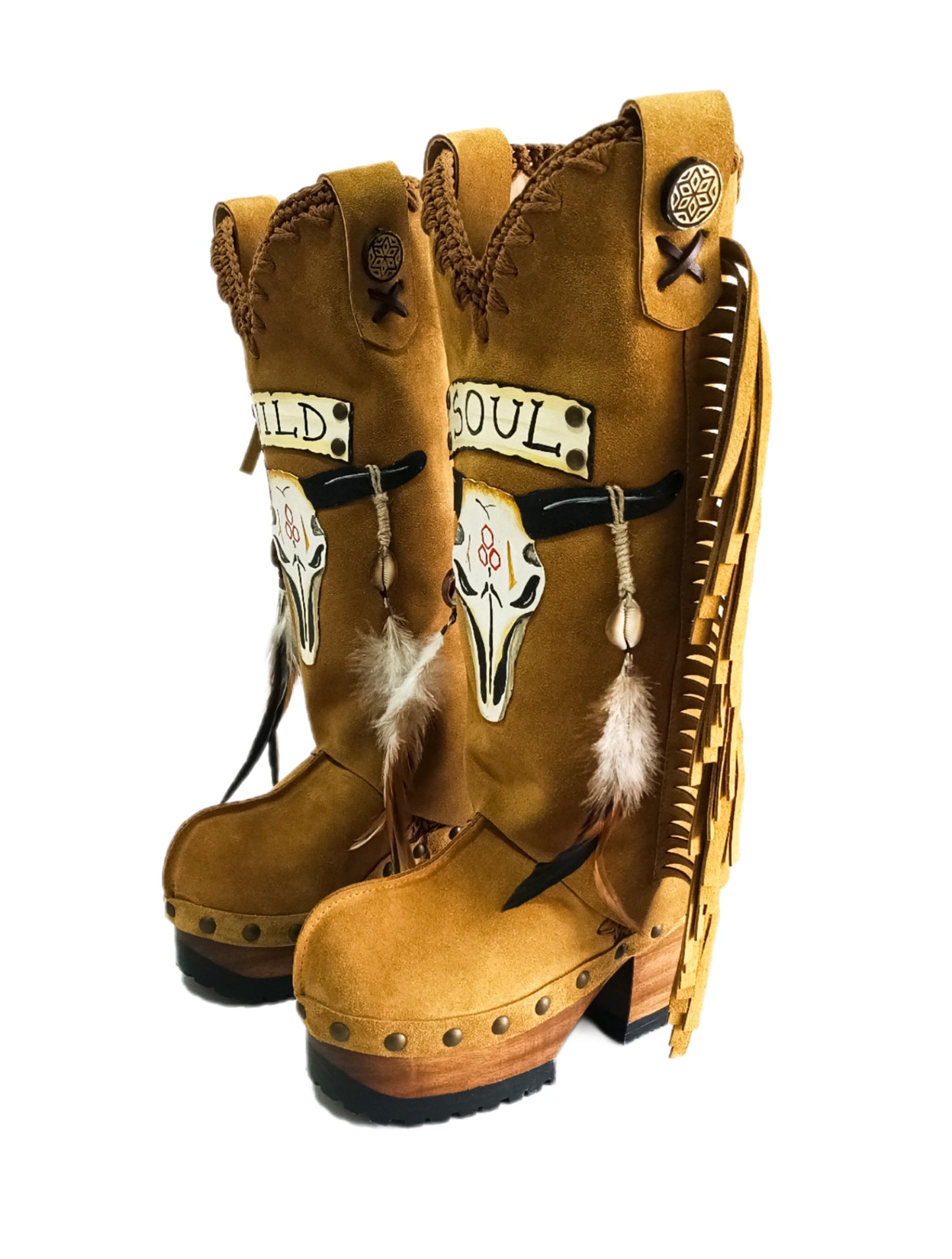 Camel suede cowboy boots. Clogs with hand-painted buffalo head, feathers, and fringes. Bohemian-style boots. High-end footwear handmade by Sol Caleyo.