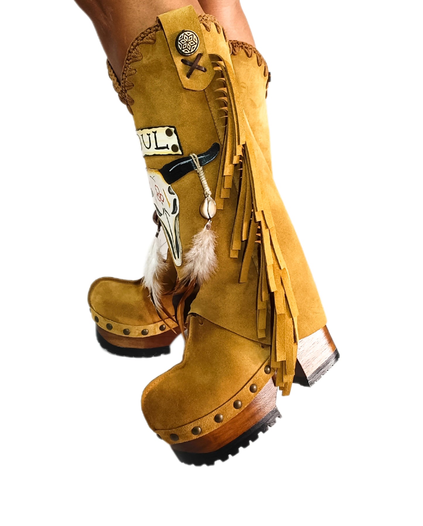 Camel suede cowboy boots. Clogs with hand-painted buffalo head, feathers, and fringes. Bohemian-style boots. High-end footwear handmade by Sol Caleyo.