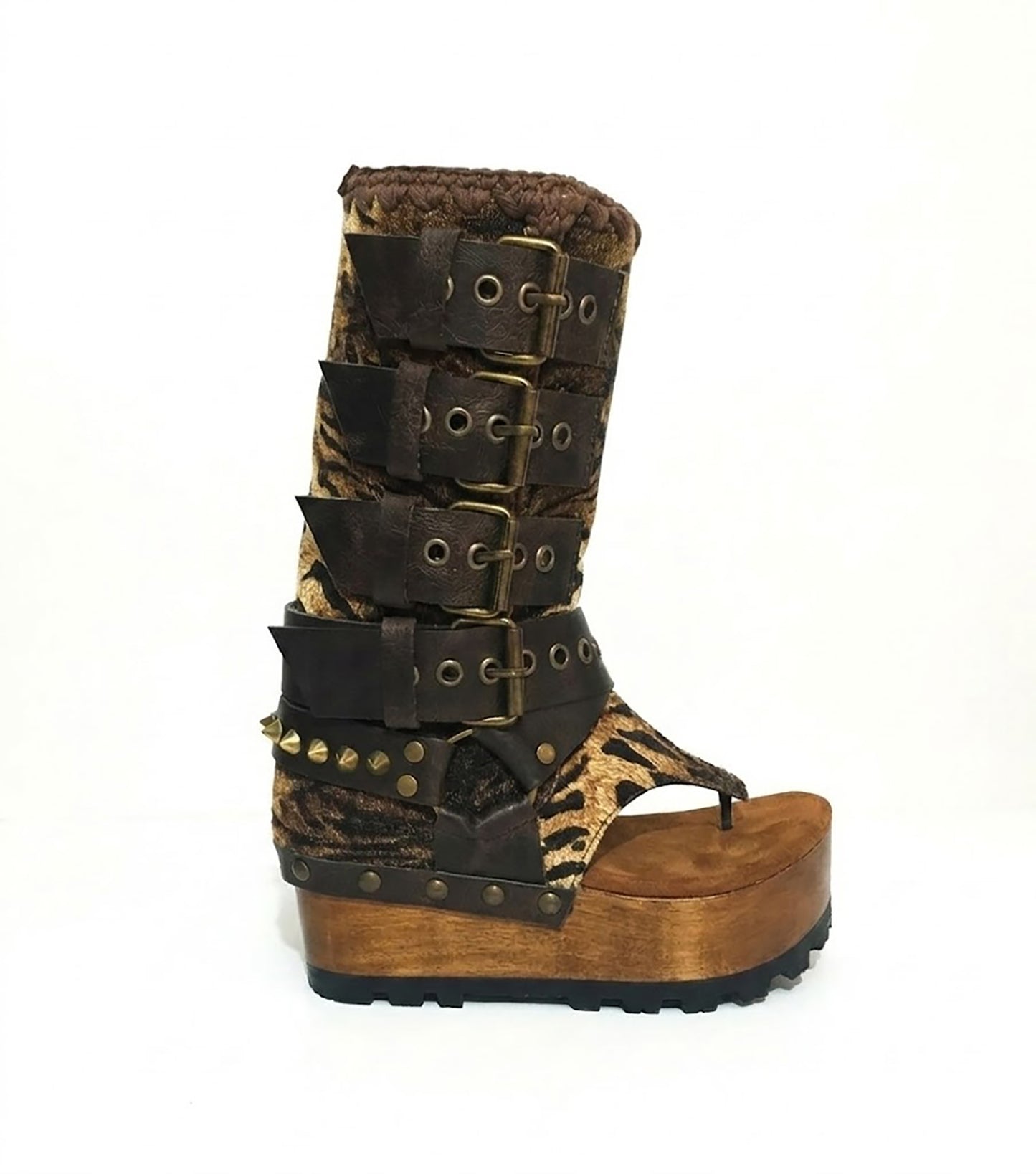 Close-up of Alabama Flip Flops Tiger Boots by Sol Caleyo. Features tiger-print premium leather, old gold pyramid studs, and a 10cm wooden wedge with black Vibram tractor soles.
