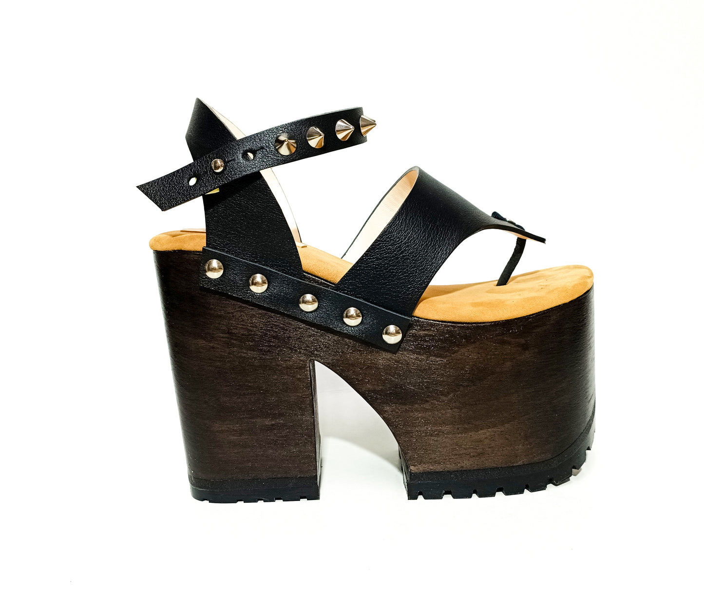 Flip flop style platform sandal. Flip flop style clog sandal. Black flip flop style sandal with silver studs. Black leather flip flop style wooden heel with silver studs. Sizes 34 to 47. Handmade leather shoes by sol Caleyo.