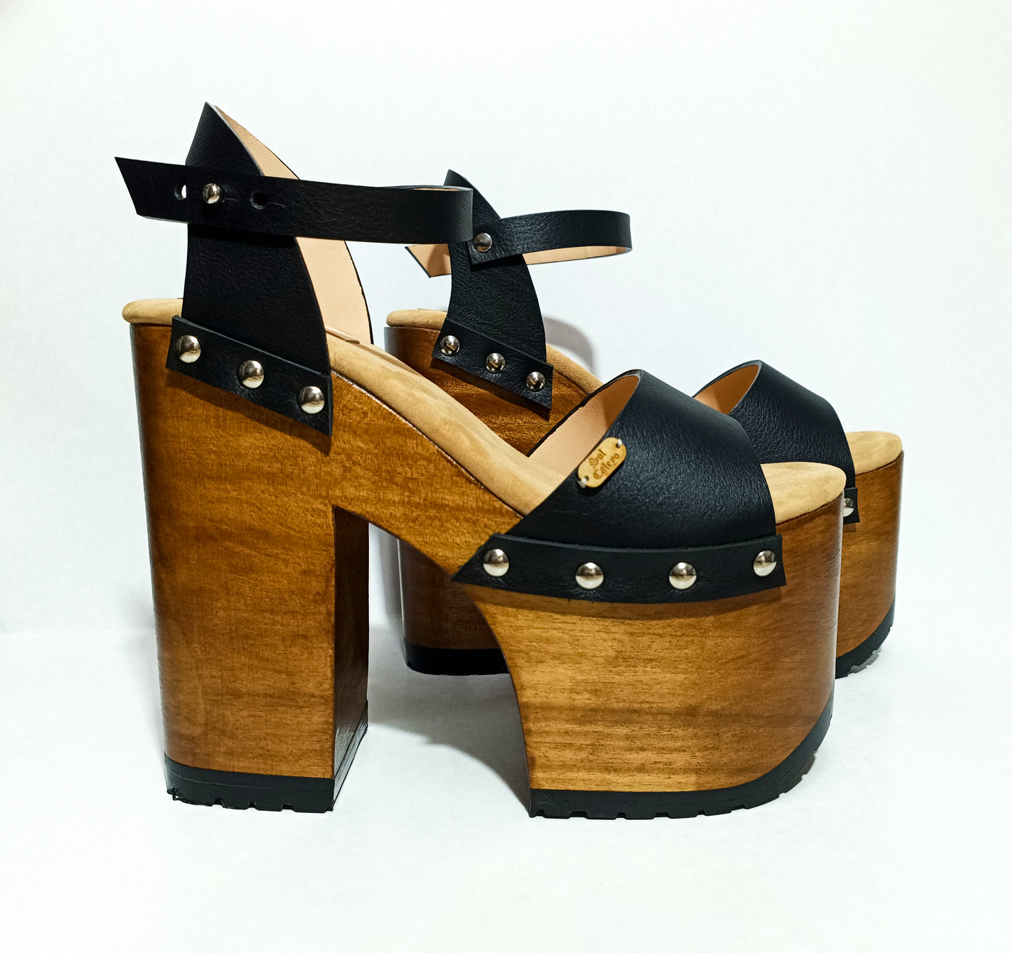 Vintage style platform sandals with super high wooden heels, made in leather. Sizes 34 to 47. Super high wooden heels inspired by the 70s. Exclusive handmade design. High quality footwear handmade by sol Caleyo.