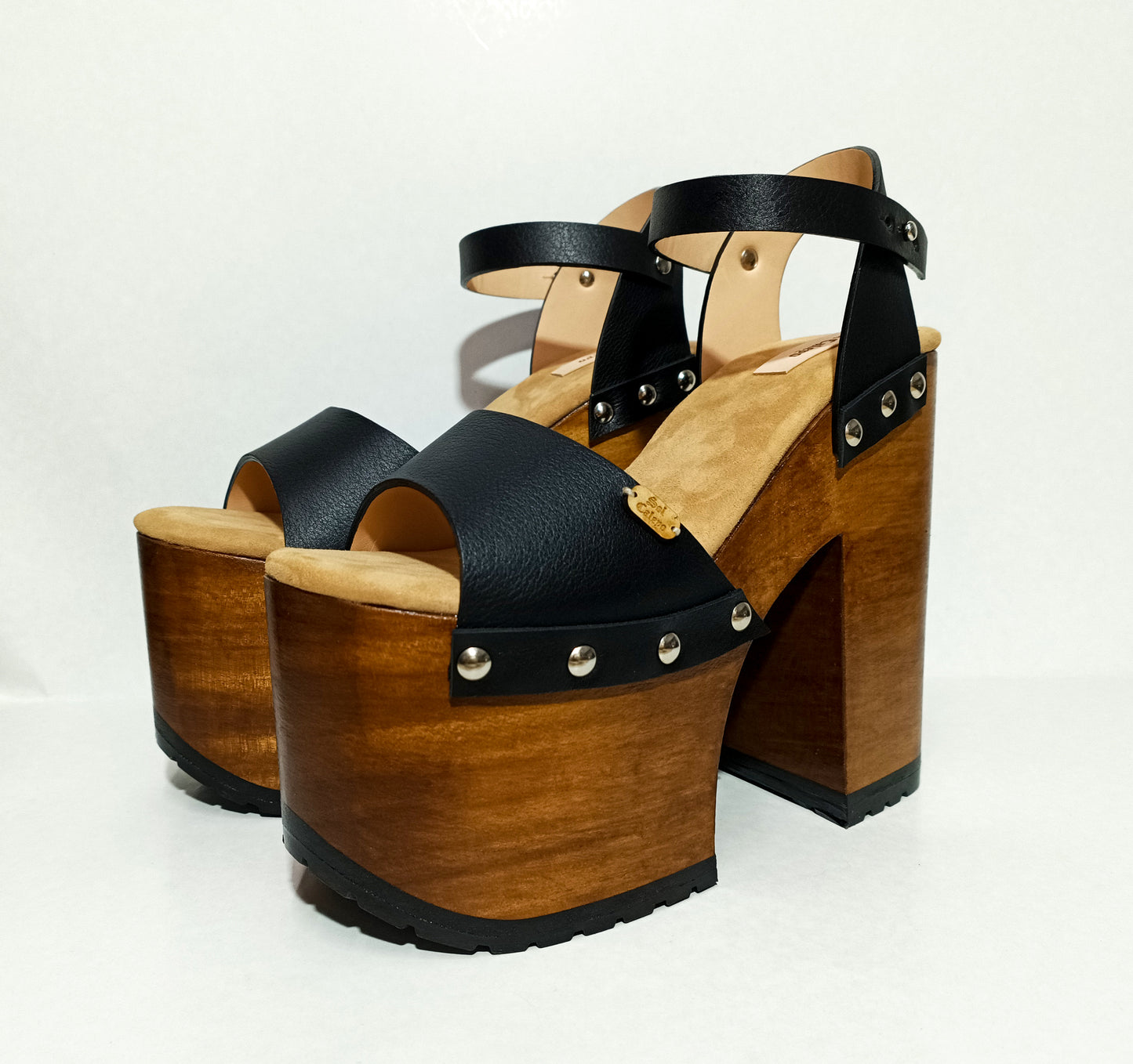Vintage style platform sandals with super high wooden heels, made in leather. Sizes 34 to 47. Super high wooden heels inspired by the 70s. Exclusive handmade design. High quality footwear handmade by sol Caleyo.