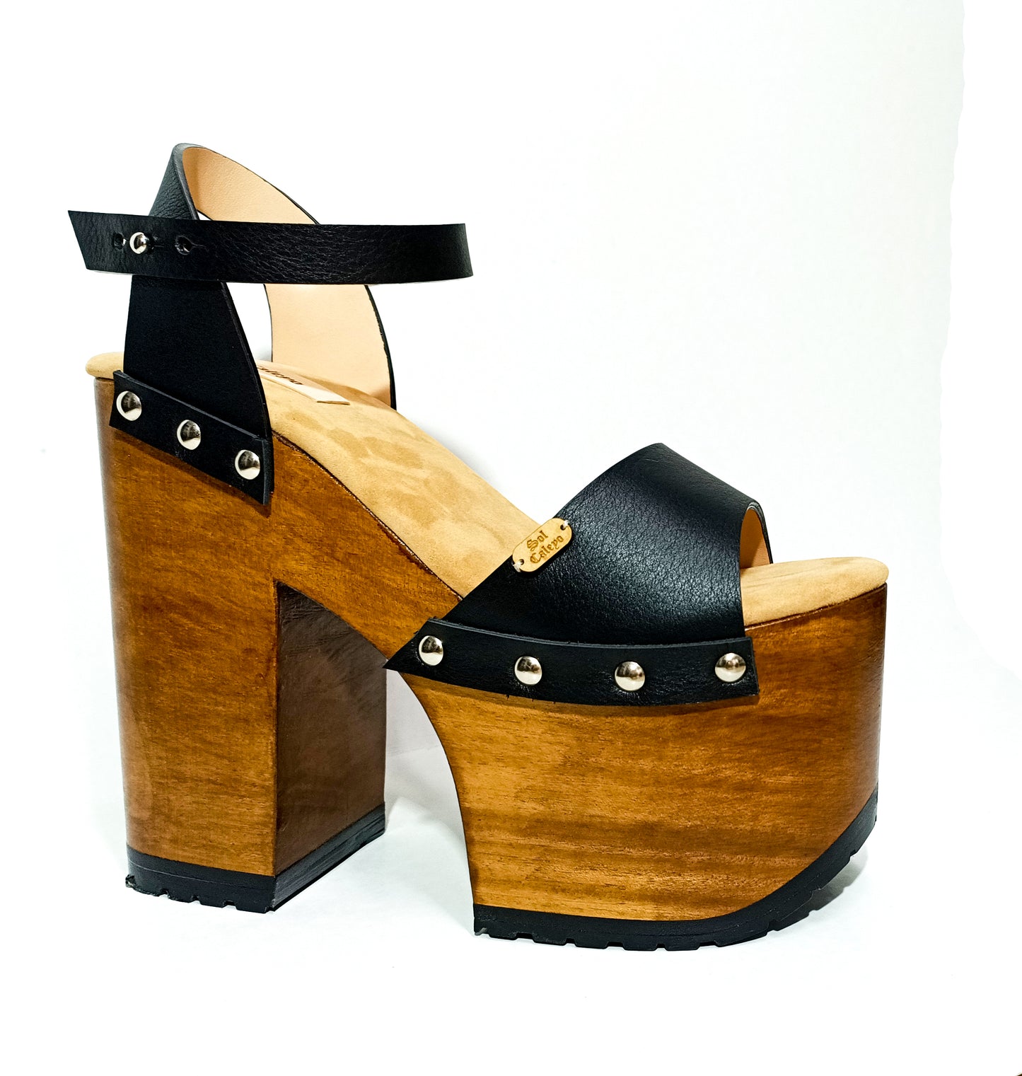 Vintage style platform sandals with super high wooden heels, made in leather. Sizes 34 to 47. Super high wooden heels inspired by the 70s. Exclusive handmade design. High quality footwear handmade by sol Caleyo.