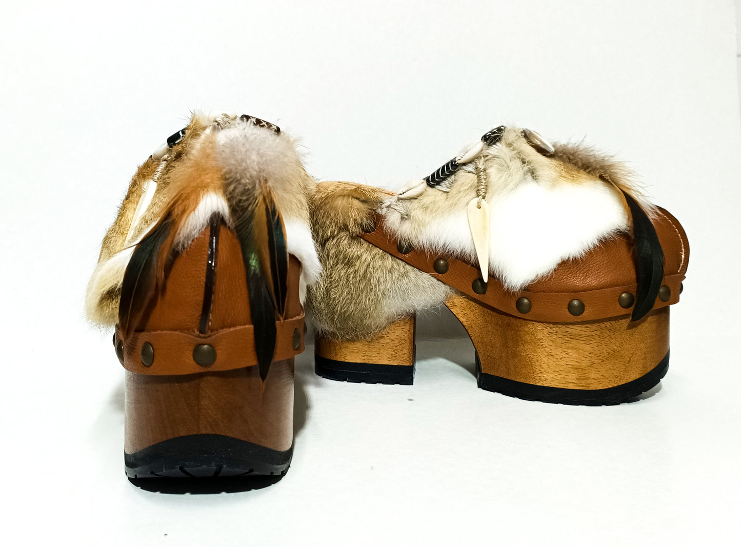 Rabbit fur and feather clogs. Vintage style platform clogs. Handmade leather clogs. Bohemian style clogs. High-end handmade footwear by Sol Caleyo.