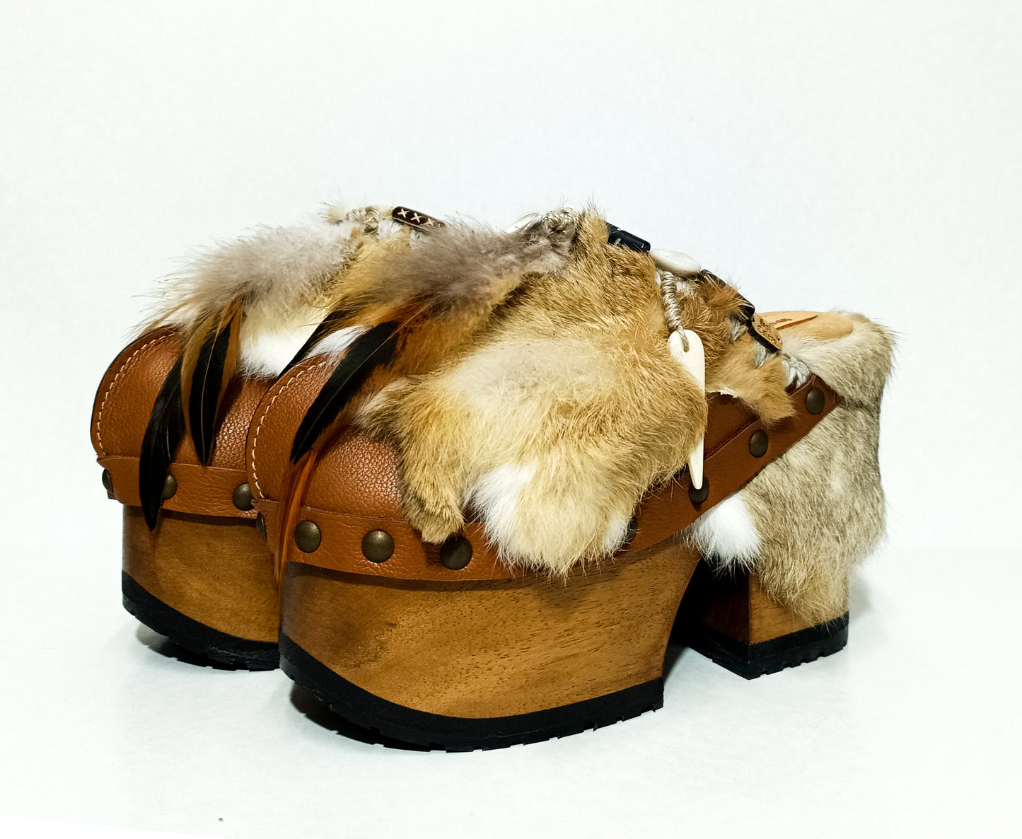 Rabbit fur and feather clogs. Vintage style platform clogs. Handmade leather clogs. Bohemian style clogs. High-end handmade footwear by Sol Caleyo.