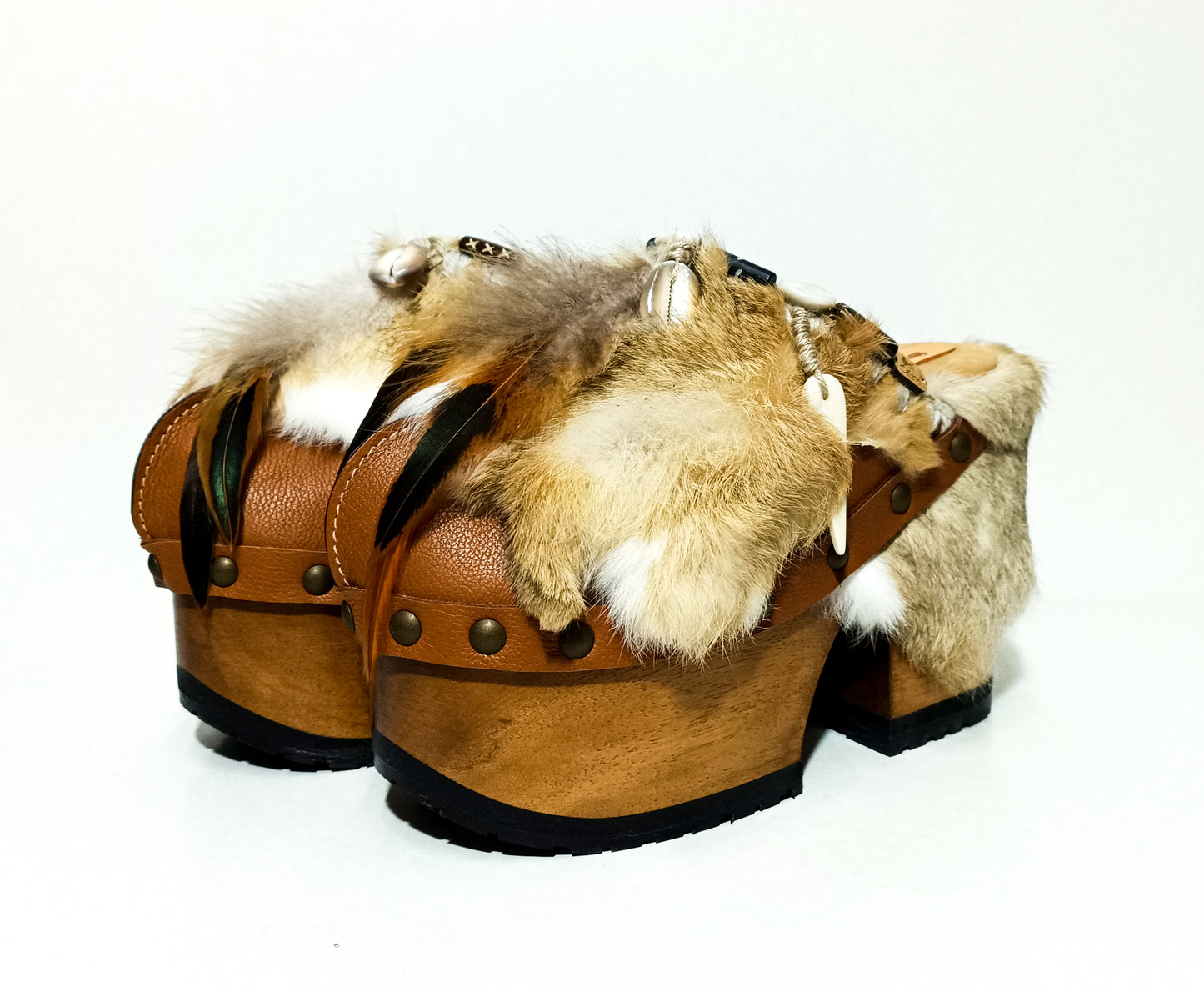 Rabbit fur and feather clogs. Vintage style platform clogs. Handmade leather clogs. Bohemian style clogs. High-end handmade footwear by Sol Caleyo.