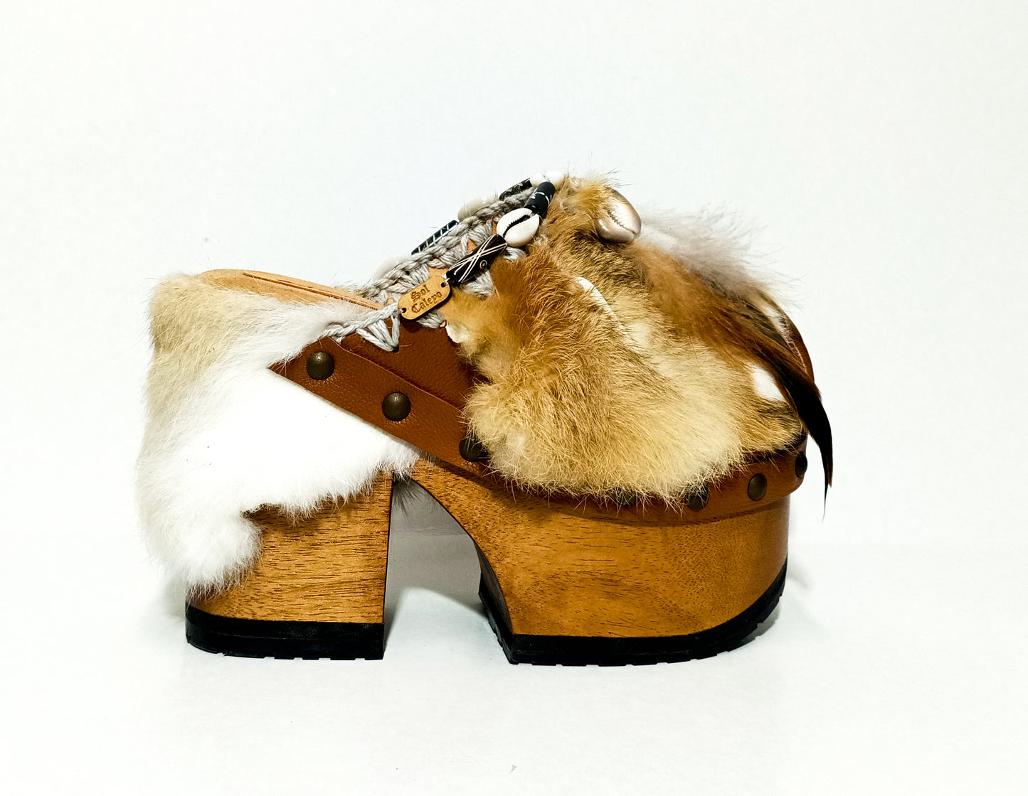 Rabbit fur and feather clogs. Vintage style platform clogs. Handmade leather clogs. Bohemian style clogs. High-end handmade footwear by Sol Caleyo.