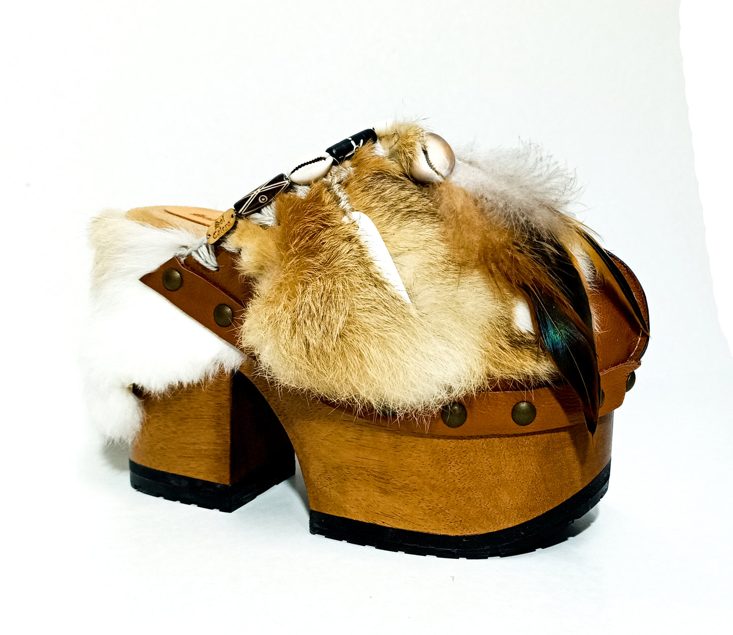 Rabbit fur and feather clogs. Vintage style platform clogs. Handmade leather clogs. Bohemian style clogs. High-end handmade footwear by Sol Caleyo.