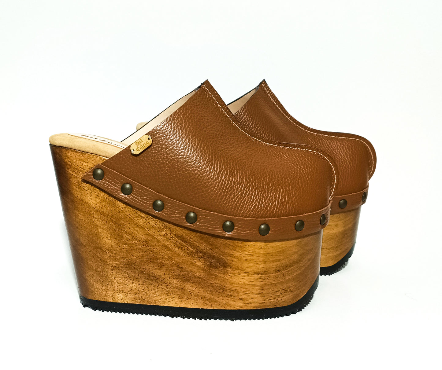 Vintage inspired, 70s style platform clogs with super high heels. Super high wooden wedge made in closed leather. Size from 34 to 47. Handmade to order. The Chicago Clogs are an exclusive design by Sol Caleyo.