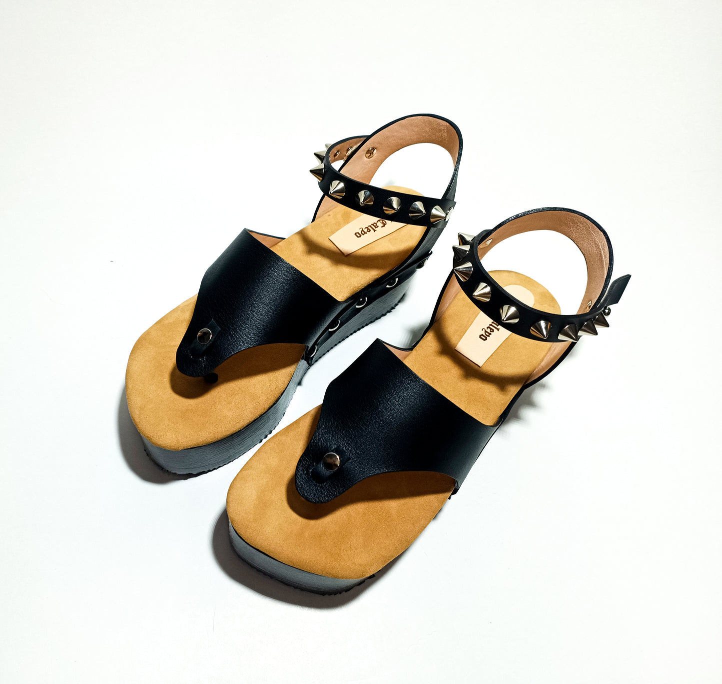 Wooden wedge sandal flip flop style. Flip flop style clog sandal. Flip flop style sandal with silver studs. Sizes 34 to 47. Handmade leather shoes by sol Caleyo.