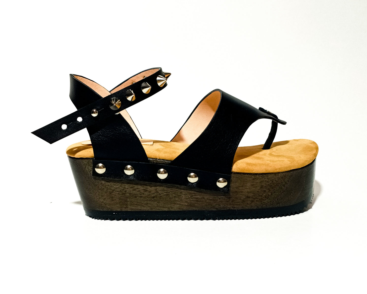 Wooden wedge sandal flip flop style. Flip flop style clog sandal. Flip flop style sandal with silver studs. Sizes 34 to 47. Handmade leather shoes by sol Caleyo.