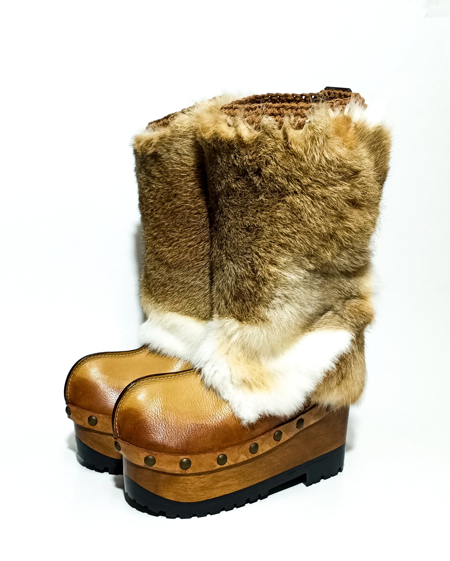 Close-up of aged beige leather and natural rabbit fur on handcrafted Sol Caleyo Nebraska boots.