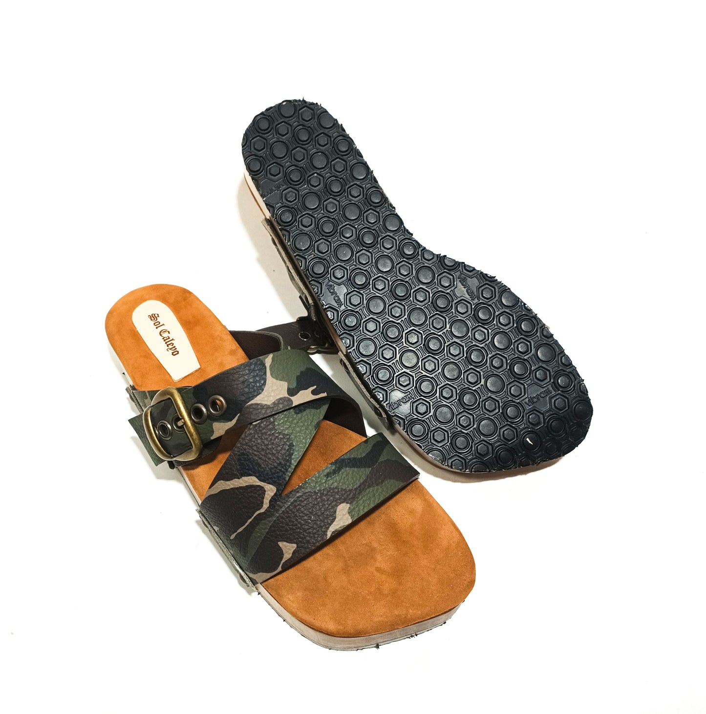 Wooden sole and black Vibram grip outsole on men’s handmade leather clog sandals.
Padded goat suede footbed inside handmade men’s leather sandals for enhanced comfort.