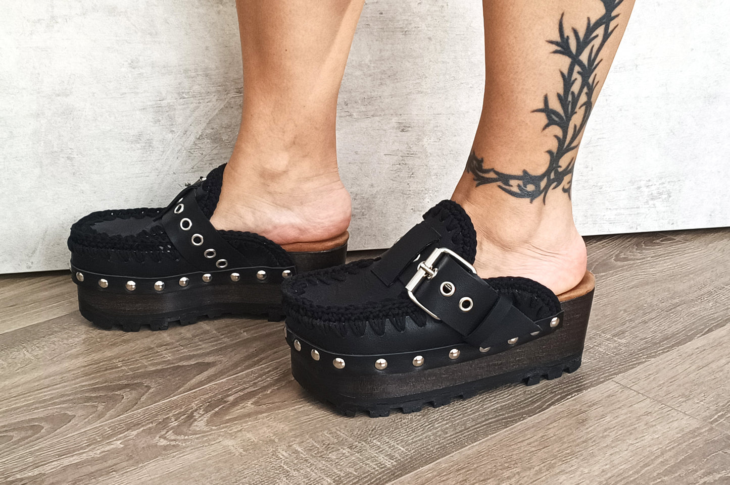 Oxford style wooden wedge clogs, black leather clogs with buckle and silver studs. High quality handmade shoes by Sol Caleyo.