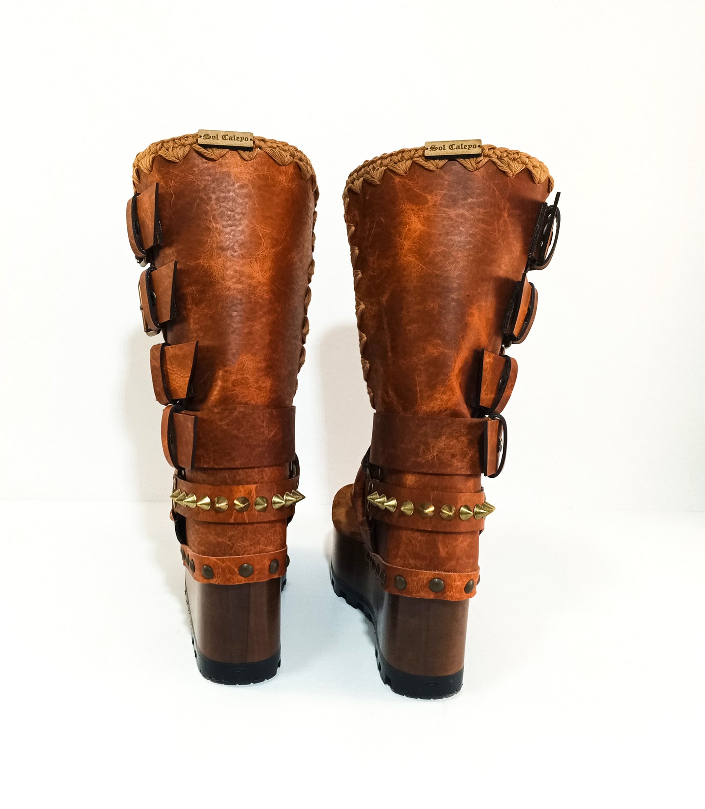 Leather biker style boots. Thong style boot. Thong sandal with wooden wedge. High-end footwear handmade by Sol Caleyo.