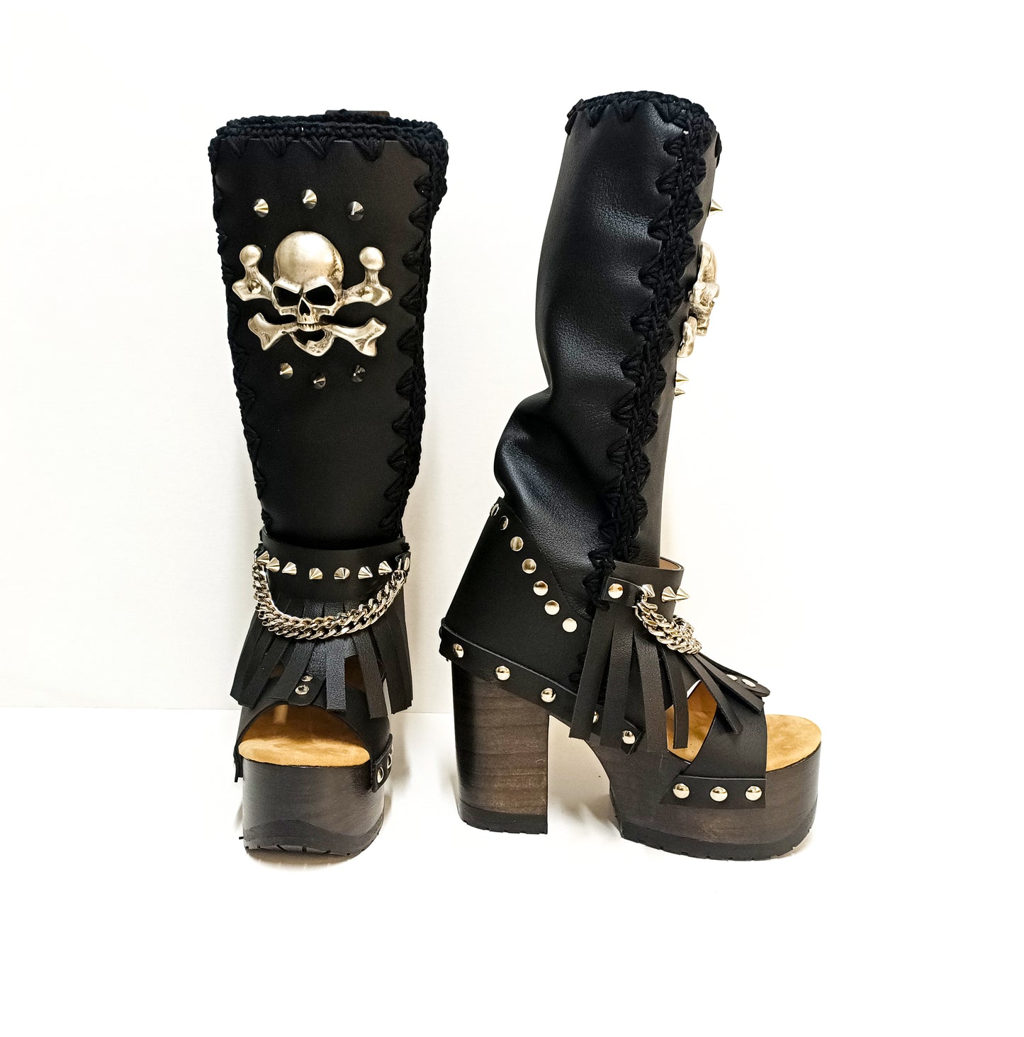 Black leather boots with skull and silver studs. Black platform boots with high heels. Black leather biker boots with metal skull. Sizes 34 to 47. High-end leather footwear handmade by Sol Caleyo.