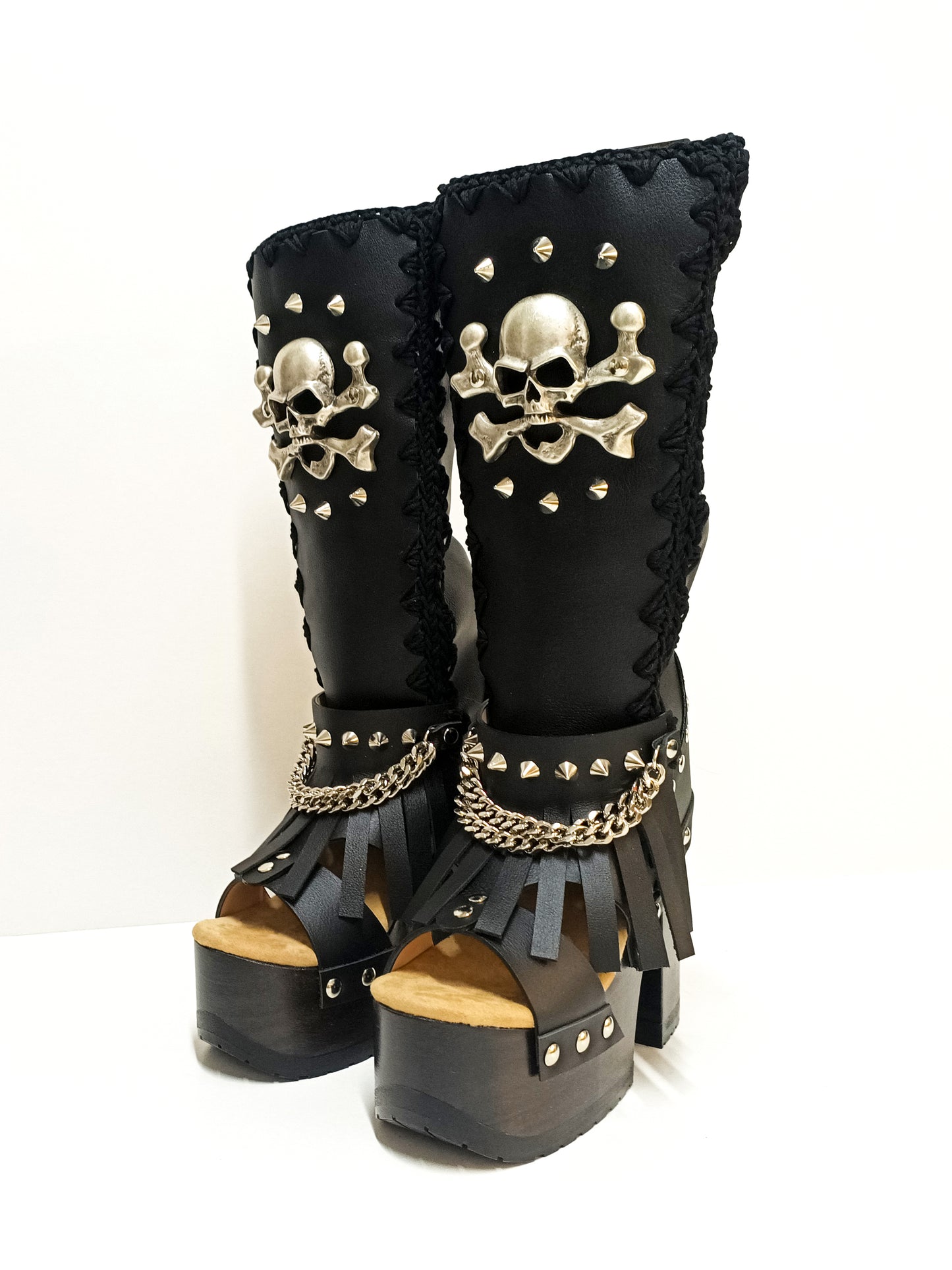 Black leather boots with skull and silver studs. Black platform boots with high heels. Black leather biker boots with metal skull. Sizes 34 to 47. High-end leather footwear handmade by Sol Caleyo.