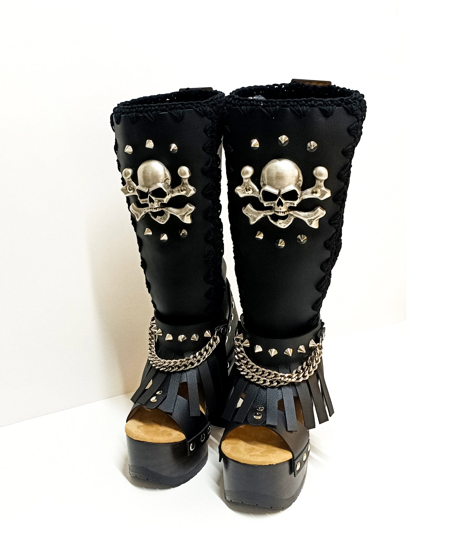 Black leather boots with skull and silver studs. Black platform boots with high heels. Black leather biker boots with metal skull. Sizes 34 to 47. High-end leather footwear handmade by Sol Caleyo.