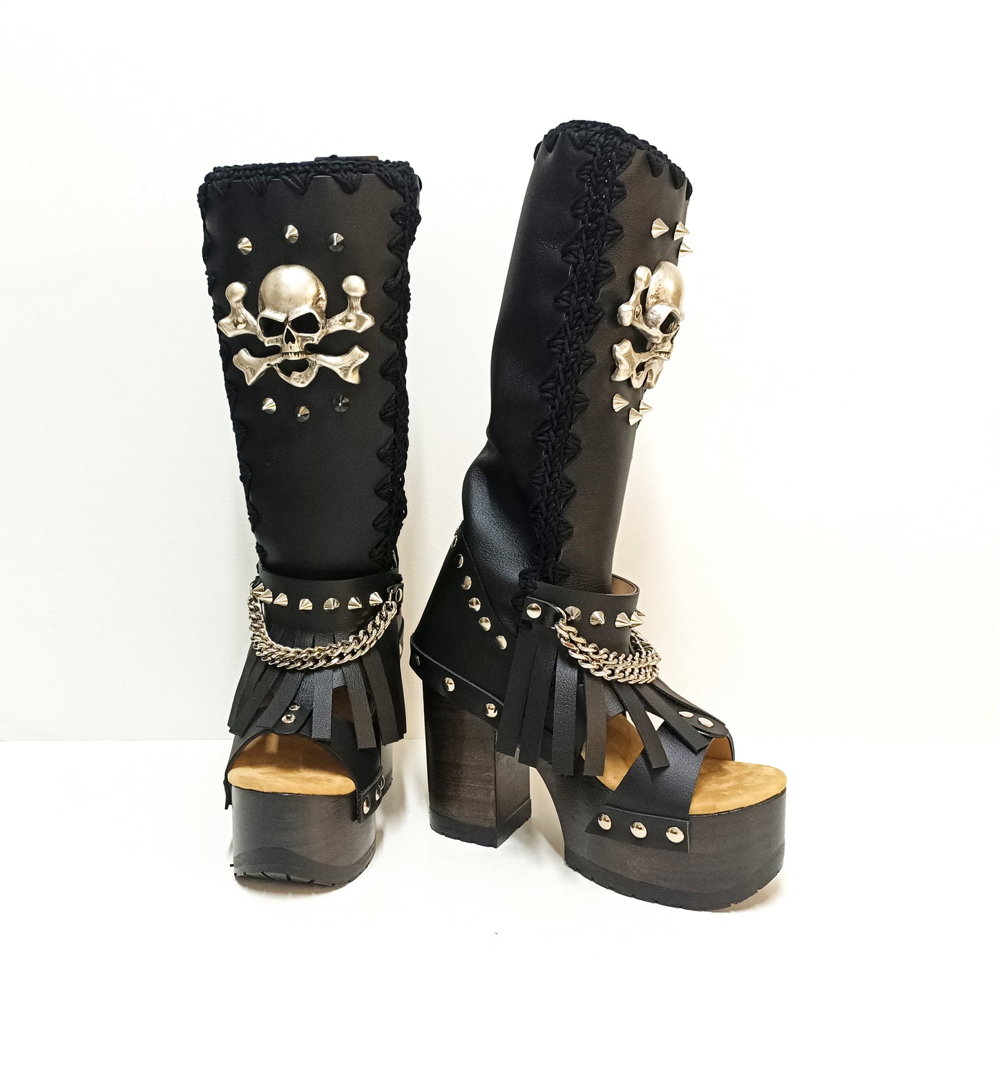 Black leather boots with skull and silver studs. Black platform boots with high heels. Black leather biker boots with metal skull. Sizes 34 to 47. High-end leather footwear handmade by Sol Caleyo.
