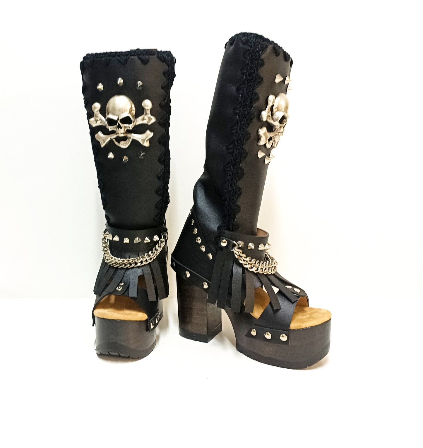 Black leather boots with skull and silver studs. Black platform boots with high heels. Black leather biker boots with metal skull. Sizes 34 to 47. High-end leather footwear handmade by Sol Caleyo.