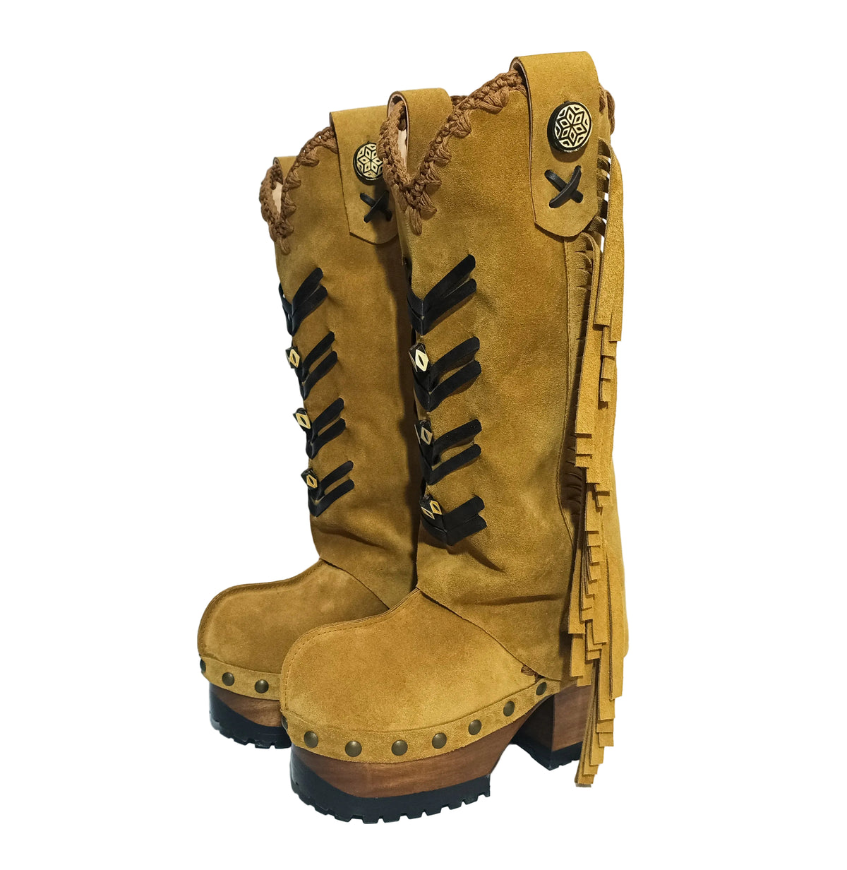 Detail of handcrafted wooden sole and tractor-style rubber outsole on bohemian platform boots.