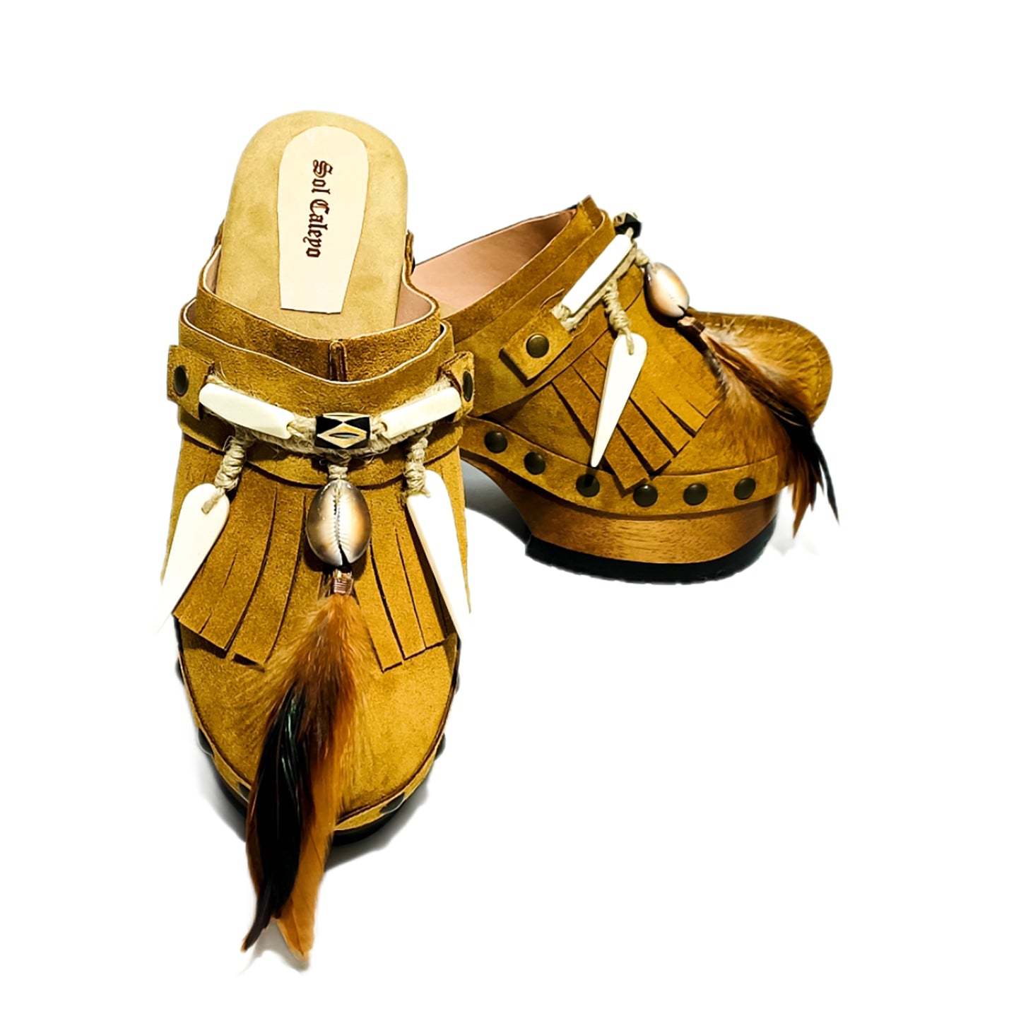 Bohemian style clogs, natural shell accessories, leather clogs decorated with feathers and natural shells. Boho style leather clogs. High-end handmade footwear by Sol Caleyo.
