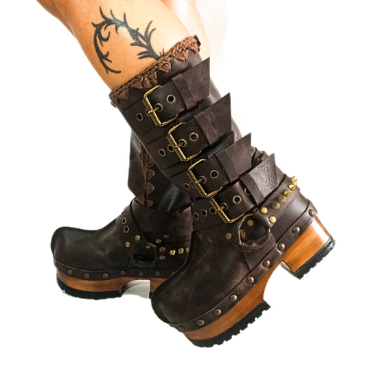 Handmade leather clogs. Dark brown leather biker boots. Leather boots with wooden heels. Leather boots with buckles. High-end footwear handmade by Sol Caleyo.