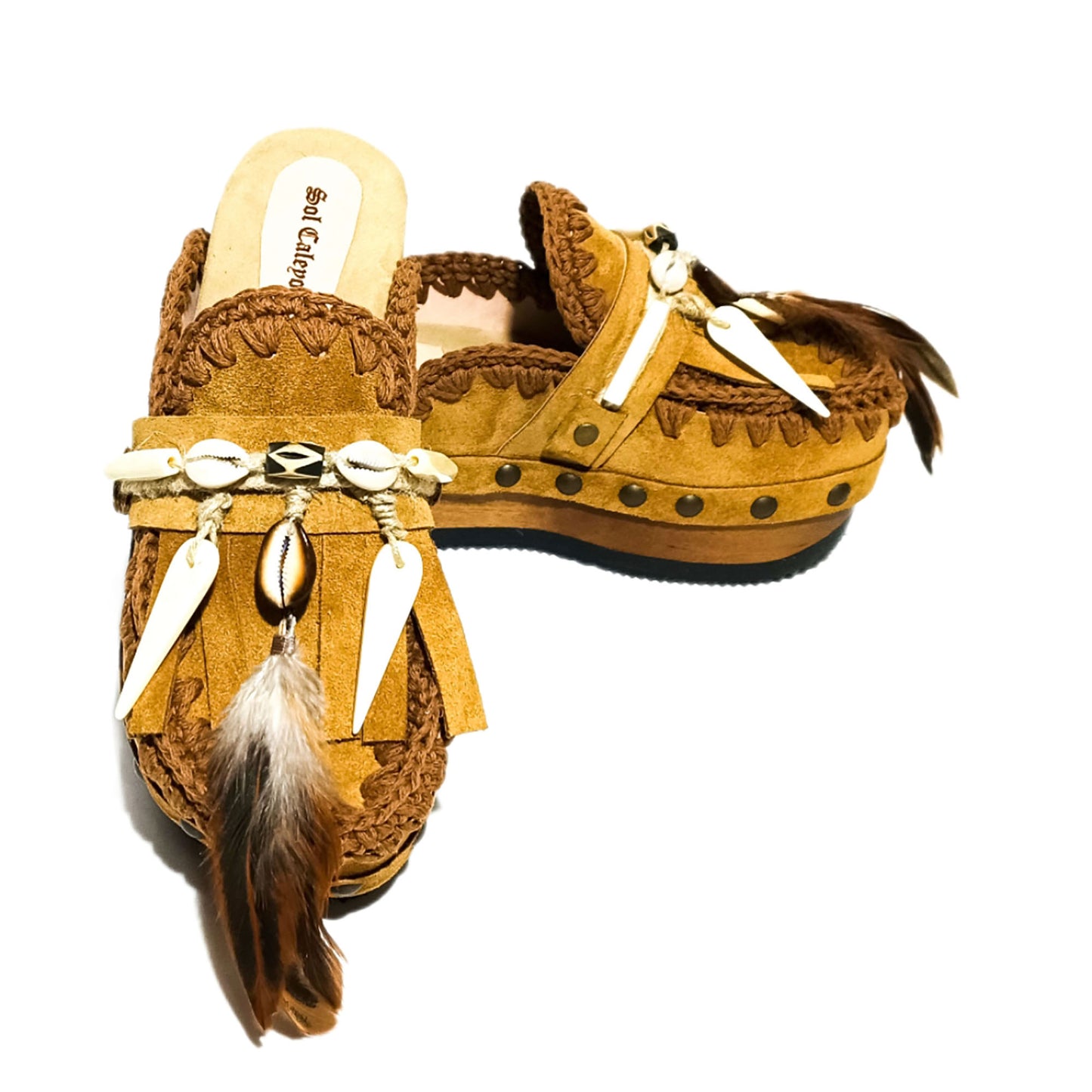 Moccasin style clogs, vintage style wooden wedge clogs. Bohemian style clogs, decorated with feathers, natural shells and horns. Moccasin clogs handmade by Sol Caleyo.