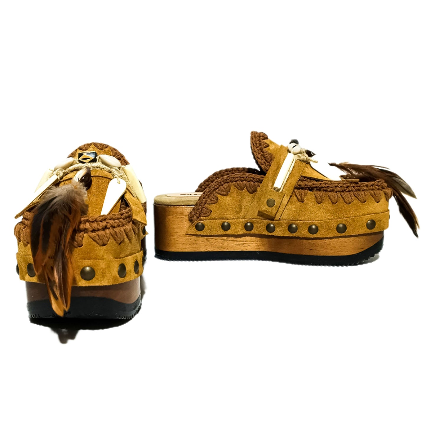 Moccasin style clogs, vintage style wooden wedge clogs. Bohemian style clogs, decorated with feathers, natural shells and horns. Moccasin clogs handmade by Sol Caleyo.
