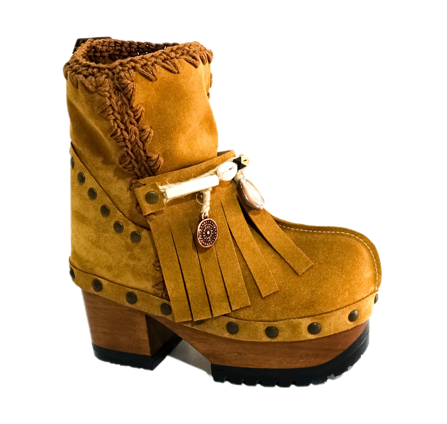 Bohemian style boots in camel suede leather. Clogs boots with handmade wooden heel. Bohemian style boots decorated with bangs, horns, coins and natural shell. High-end handmade footwear by Sol Caleyo.