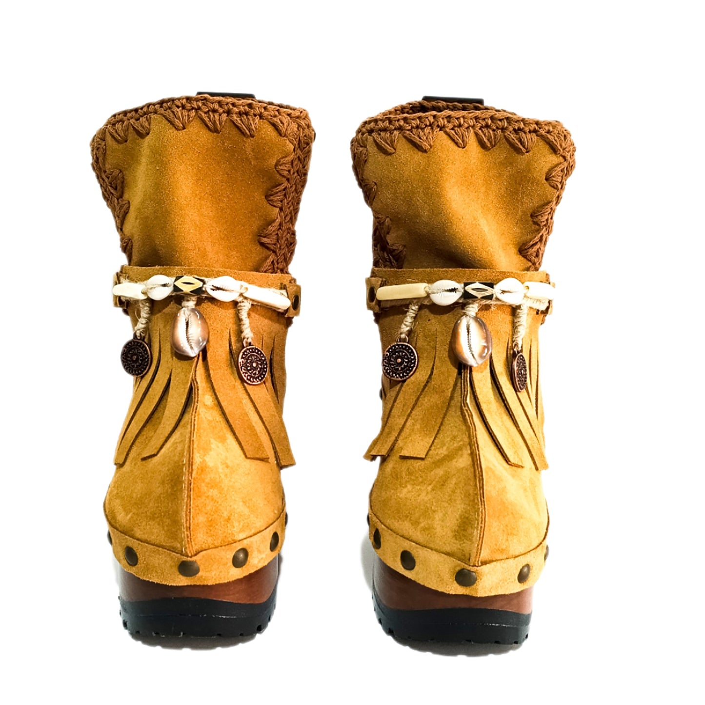 Bohemian style boots in camel suede leather. Clogs boots with handmade wooden heel. Bohemian style boots decorated with bangs, horns, coins and natural shell. High-end handmade footwear by Sol Caleyo.