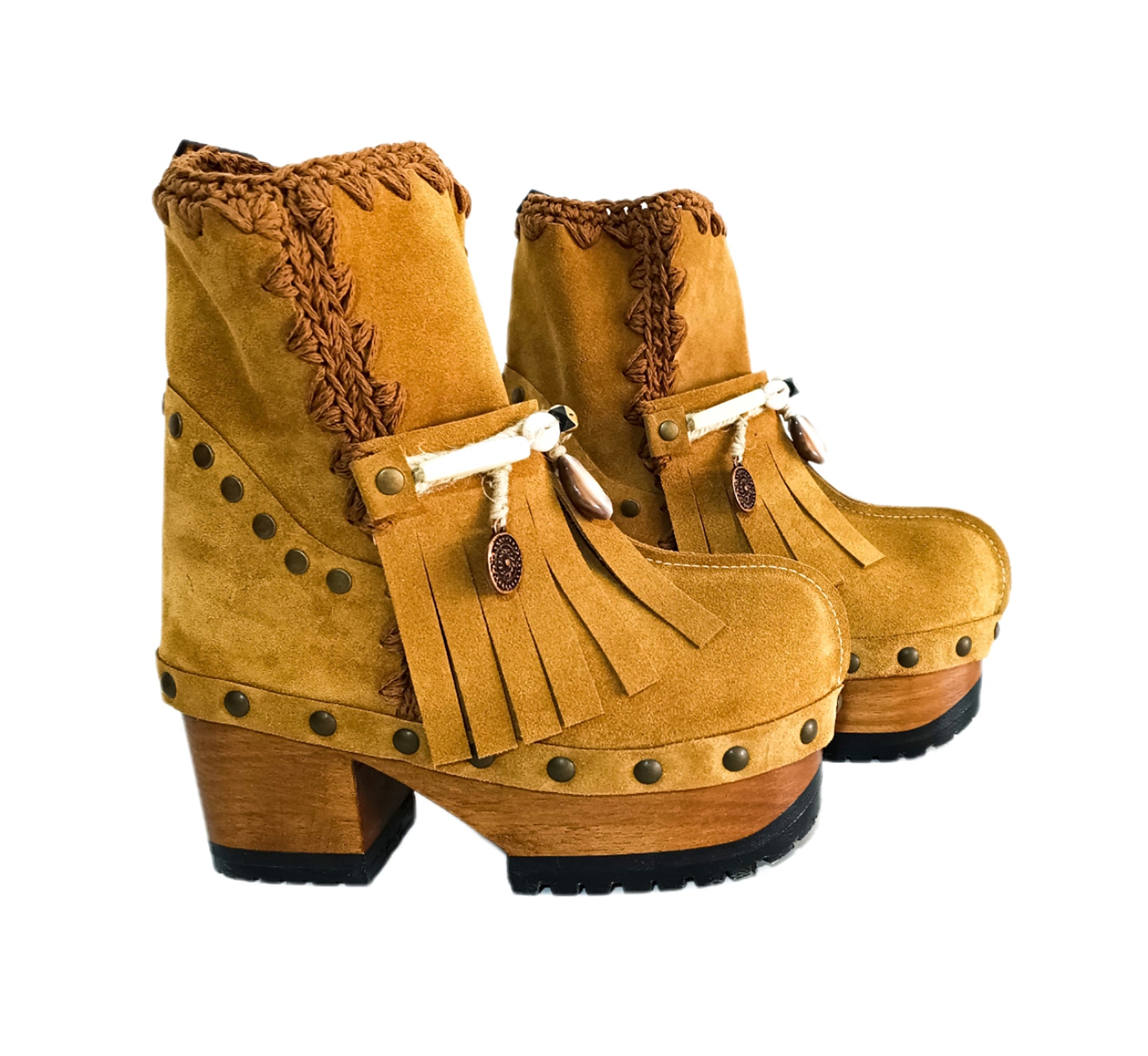 Bohemian style boots in camel suede leather. Clogs boots with handmade wooden heel. Bohemian style boots decorated with bangs, horns, coins and natural shell. High-end handmade footwear by Sol Caleyo.