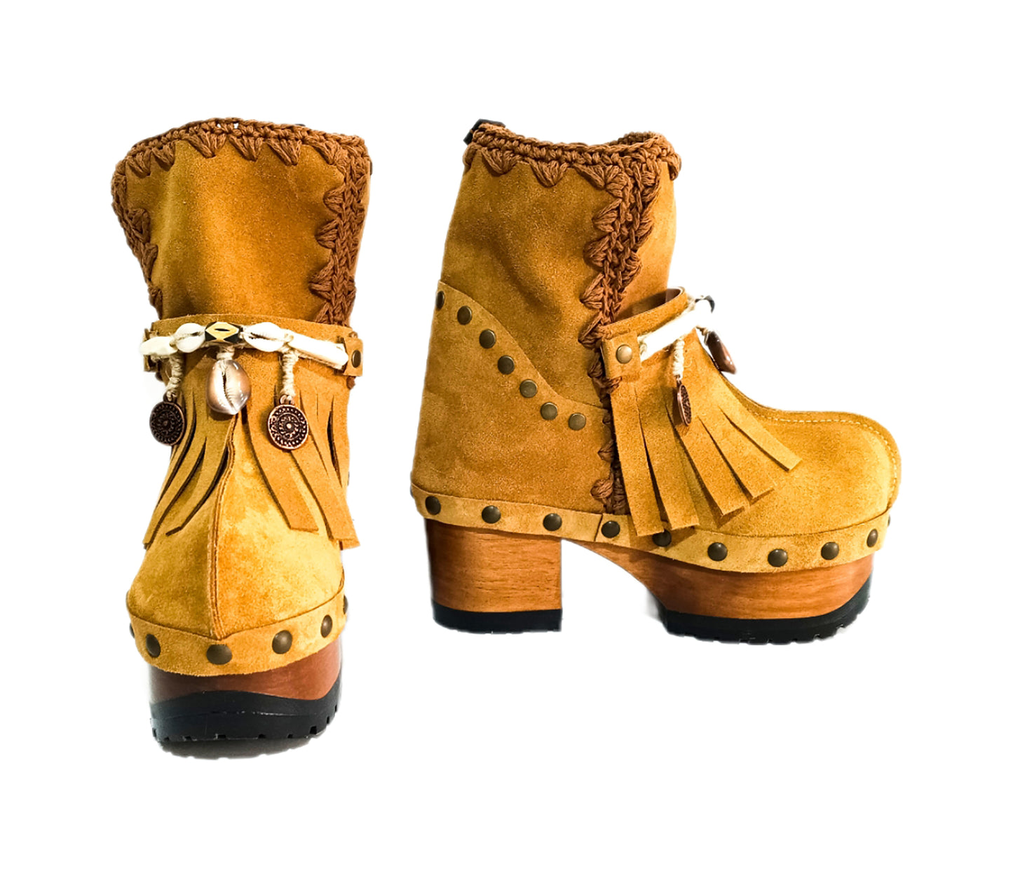 Bohemian style boots in camel suede leather. Clogs boots with handmade wooden heel. Bohemian style boots decorated with bangs, horns, coins and natural shell. High-end handmade footwear by Sol Caleyo.