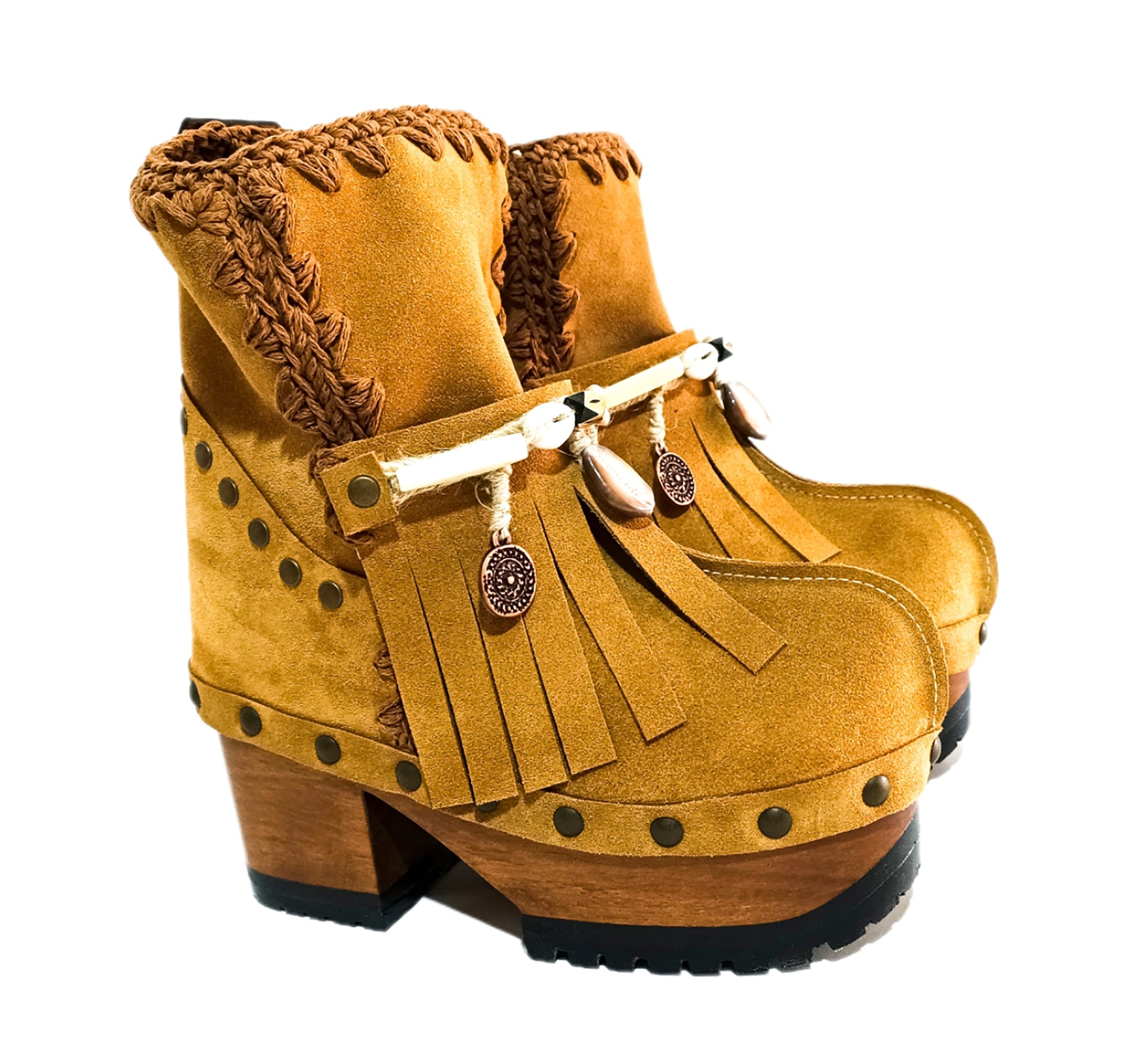 Bohemian style boots in camel suede leather. Clogs boots with handmade wooden heel. Bohemian style boots decorated with bangs, horns, coins and natural shell. High-end handmade footwear by Sol Caleyo.
