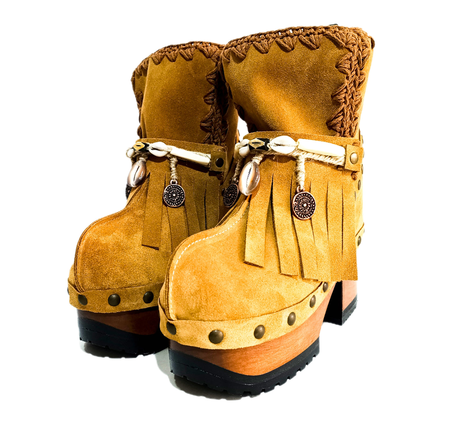 Bohemian style boots in camel suede leather. Clogs boots with handmade wooden heel. Bohemian style boots decorated with bangs, horns, coins and natural shell. High-end handmade footwear by Sol Caleyo.