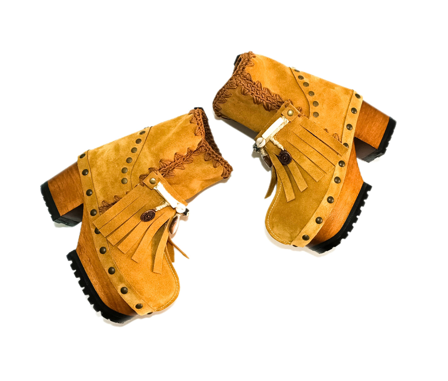 Bohemian style boots in camel suede leather. Clogs boots with handmade wooden heel. Bohemian style boots decorated with bangs, horns, coins and natural shell. High-end handmade footwear by Sol Caleyo.