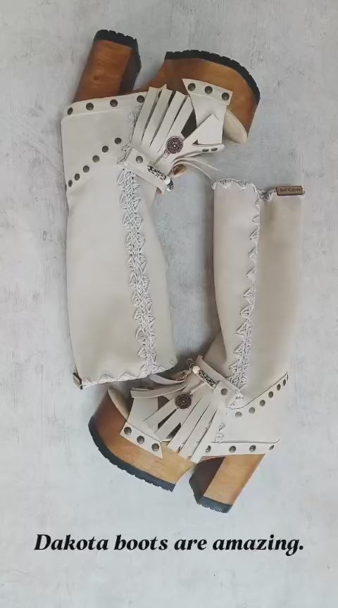 Bohemian style wooden heeled clog boot. Suede leather boot decorated with fringes, natural shells, coins and carved bone with an authentic bohemian style. Boho style boots. Sizes 34 to 47. Handmade leather footwear by sol Caleyo.