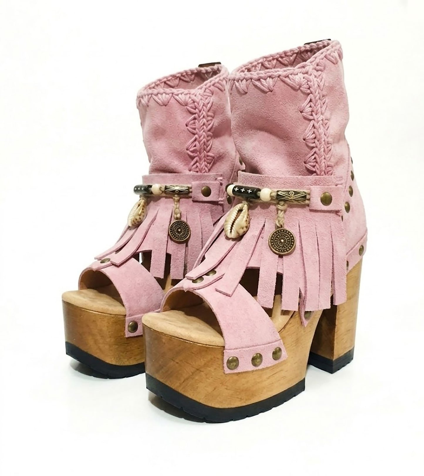 Sol Caleyo Pink Aruba Boots: handmade pink suede platform sandals with wooden heel and bohemian shell and coin decorations.