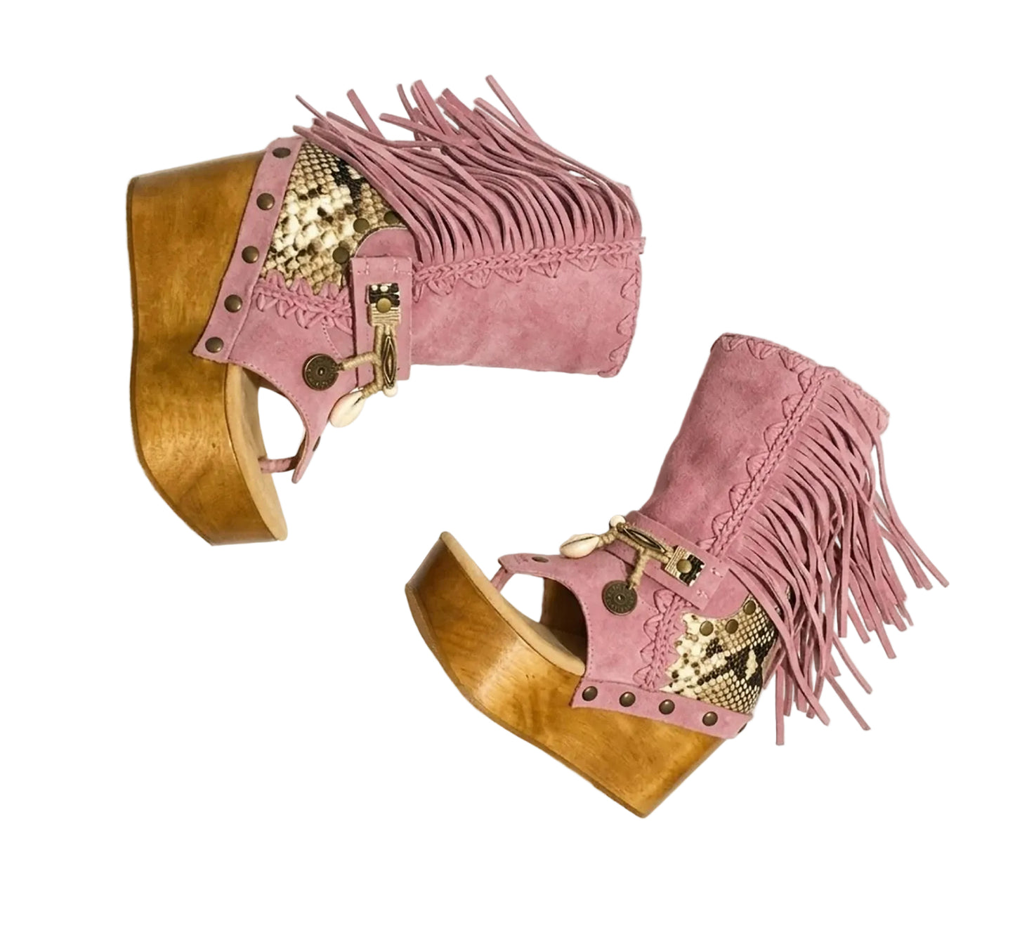 Handmade Atenea Pink Flip Flop Boots by Sol Caleyo, featuring pink suede leather, fringe details, shells, vintage coins, and a high wooden platform sole on a white background