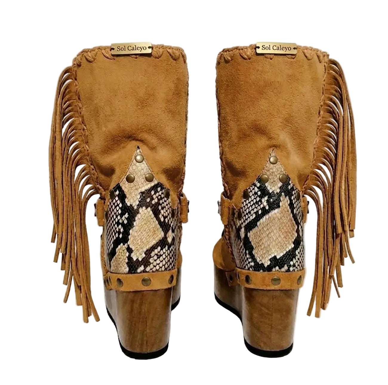 Handmade Atenea Camel Flip Flop Boots by Sol Caleyo, featuring warm camel-colored suede, bohemian fringes, shell embellishments, snake-print details, and a high wooden platform sole on a white background.