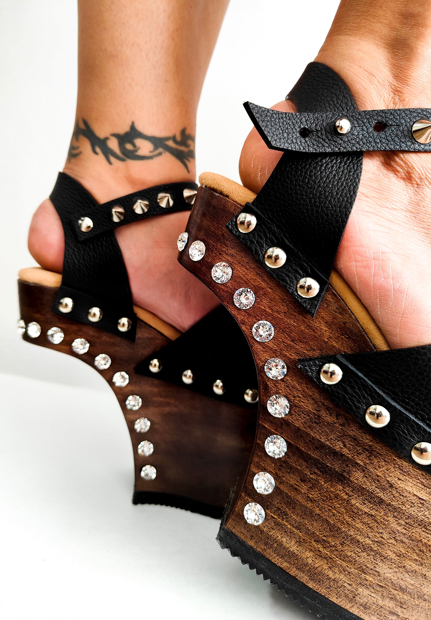 Black leather platform sandal with silver studs. Wooden wedge heel in C decorated with swarovski crystals. Super high heel sandal with genuine swarovski crystals. Super high heel sandal without heel. Sizes 34 to 47. High quality leather shoes handmade by sol Caleyo. Sustainable fashion.