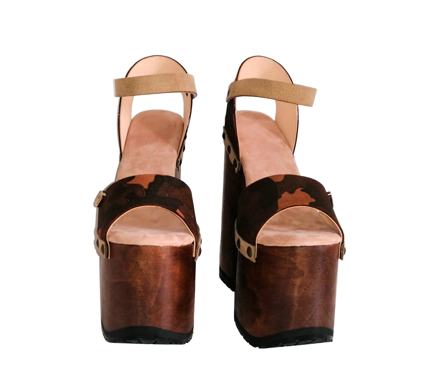Sol Caleyo Crazy Sandals - side view of handcrafted camouflage leather platform clogs with wooden soles, gold-tone studs, and adjustable ankle straps on a white background.