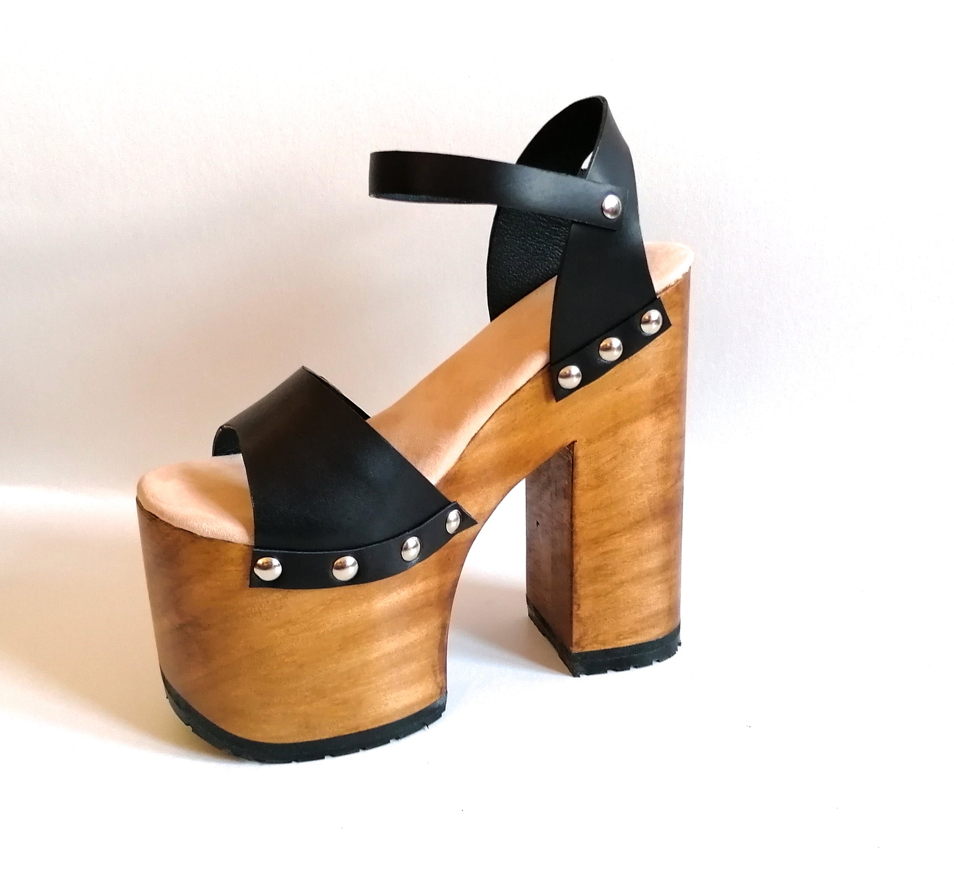 Vintage style platform sandals with super high wooden heels, made in leather. Sizes 34 to 47. Super high wooden heels inspired by the 70s. Exclusive handmade design. High quality footwear handmade by sol Caleyo.