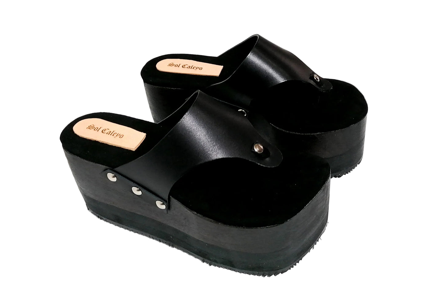 Black flip flop style platform clog sandal. Platform wedge. Black leather flip flop style sandal. Sizes 34 to 47. High quality leather shoes handmade by Sol Caleyo.