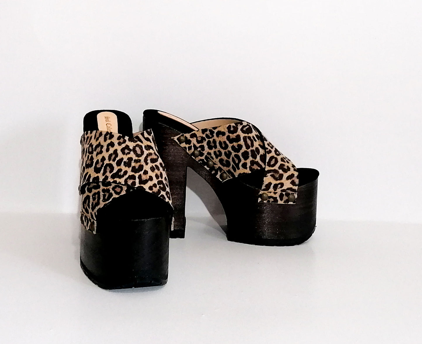Leopard leather clogs with platform and super high heel. Leather mule with super high wooden heel. Vintage 70's style leather clogs. Vintage style super high heel sandal. Sizes 34 to 47. High quality leather shoes handmade by sol Caleyo. Sustainable fashion.