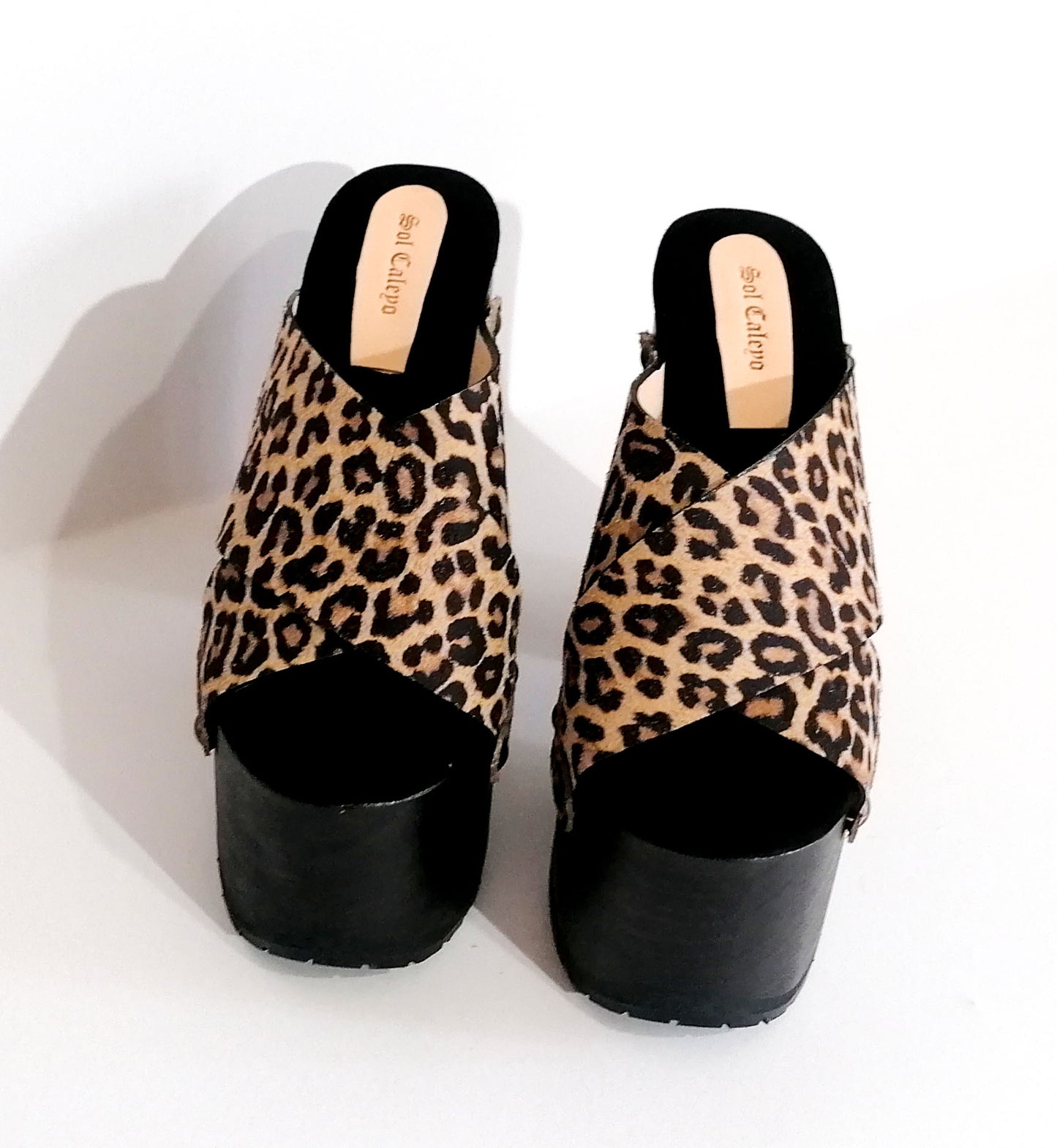 Leopard leather clogs with platform and super high heel. Leather mule with super high wooden heel. Vintage 70's style leather clogs. Vintage style super high heel sandal. Sizes 34 to 47. High quality leather shoes handmade by sol Caleyo. Sustainable fashion.
