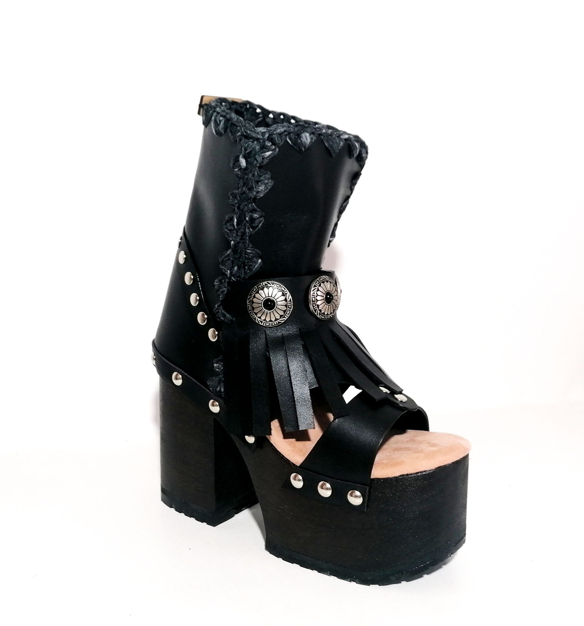 Black leather platform sandal. Leather boot with super high wooden heel. Black leather boot decorated with fringes and silver conchos. Bohemian style boots. Sizes 34 to 47. High quality leather shoes handmade by sol Caleyo. Sustainable fashion.