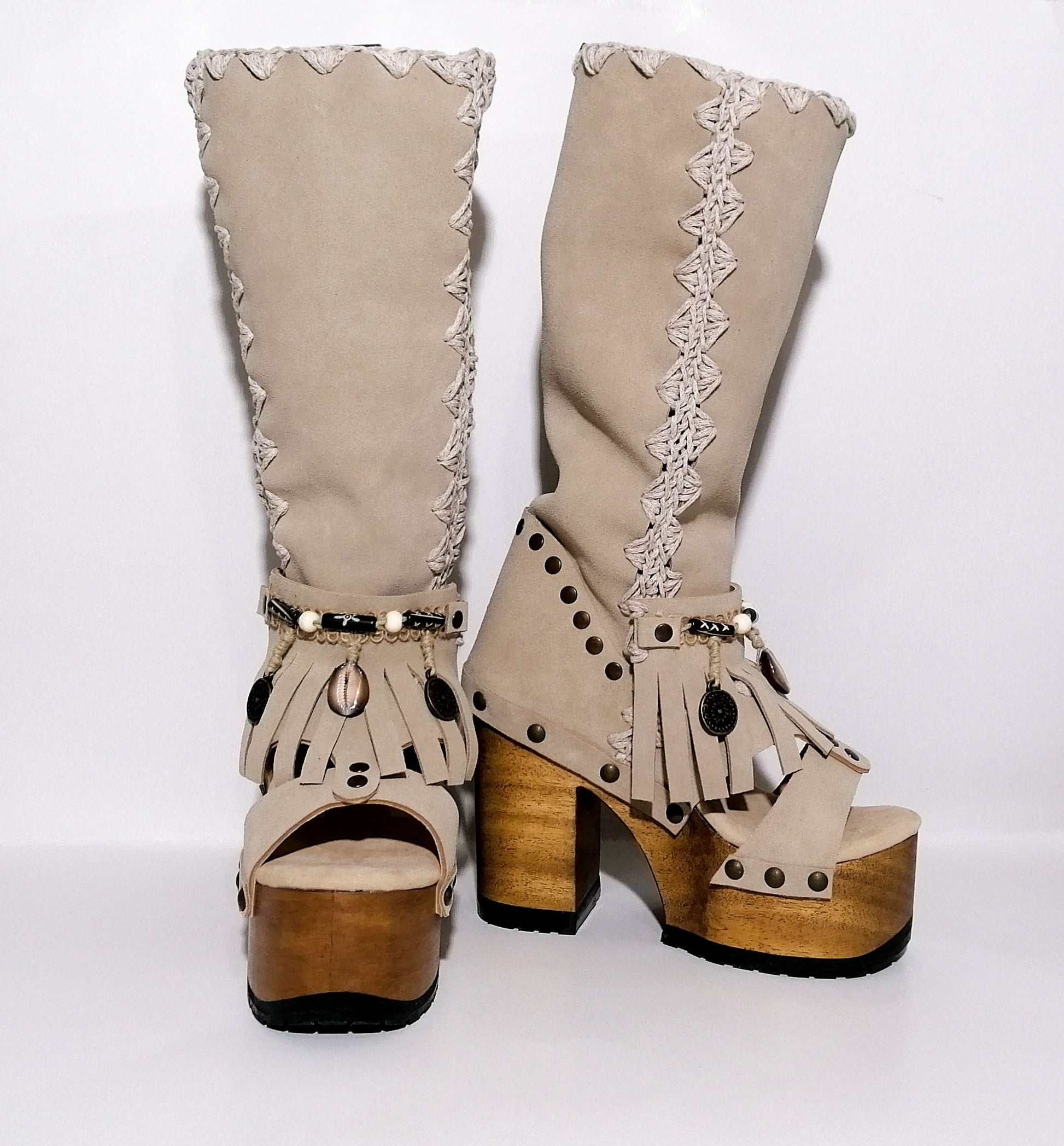Vintage style wooden heeled clog boot. Suede leather boot decorated with fringes, natural shells, coins and carved bone with an authentic bohemian style. Boho style boots. Sizes 34 to 47. Handmade leather footwear by sol Caleyo.