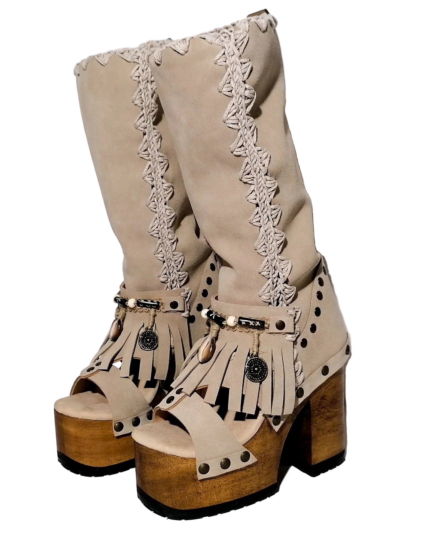 Handcrafted Dakota beige suede platform boots by Sol Caleyo featuring boho fringe, natural shells, and old gold coins on a 12cm sculpted wooden heel.